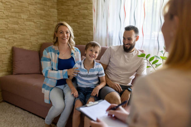istock Happy couple and their son talking whit psychiatrist 1465482568