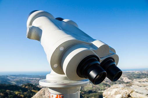 A selective focus shot of coin-operated binoculars