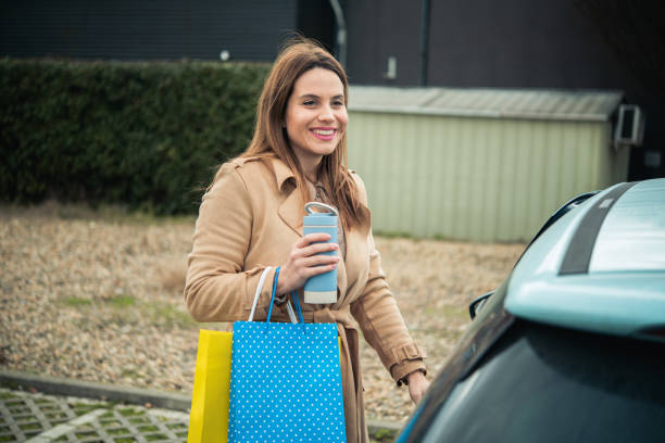 istock Happy woman coming back from shopping mall 1465484015