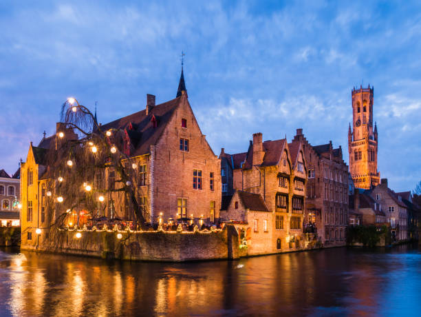 istock Illuminated river surrounded by buildings in the evening in Bruges, Belgium 1465484425