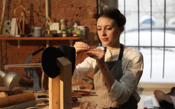 istock Leather handbag craftswoman at work in a workshop 1465485151