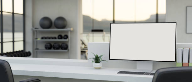 istock Fitness gym center reception desk with computer mockup for display your graphic 1465485403