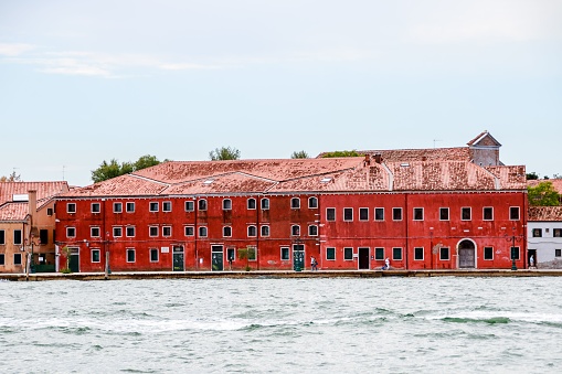 A beautiful shot of the historic Residenza Grandi Vedute building across the water in Venice, italy