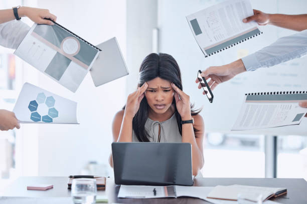 istock Stress, hands and business woman with headache from multitasking, workload and work pressure in office. Anxiety, hand and black woman suffering with burnout, chaos and deadline at corporate job 1465489358