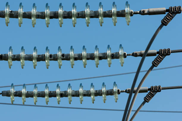 istock Closeup of cap isolator chains on a blue sky background 1465489933