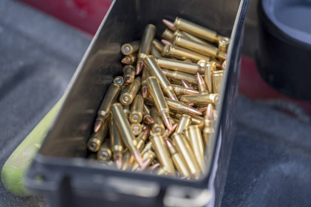 istock Selective focus of a box full of gun bullets 1465490045