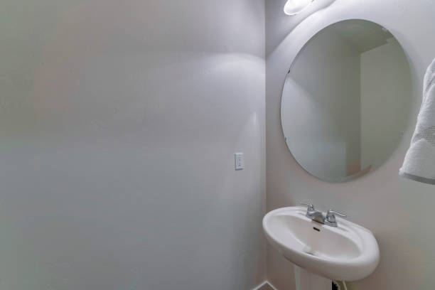 istock Minimalistic bathroom interior design in white color with a sink 1465490532