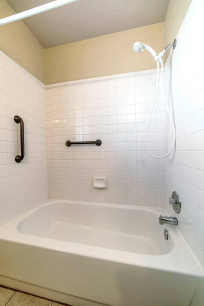 istock Minimalistic bathroom interior design in white color with a shower cabin 1465490581