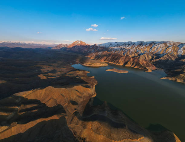 istock Panoramic view of mountains and lake 1465492360