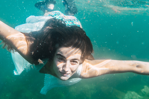 Young Woman Will Dive With A White Dress Swimming Underwater Image ...