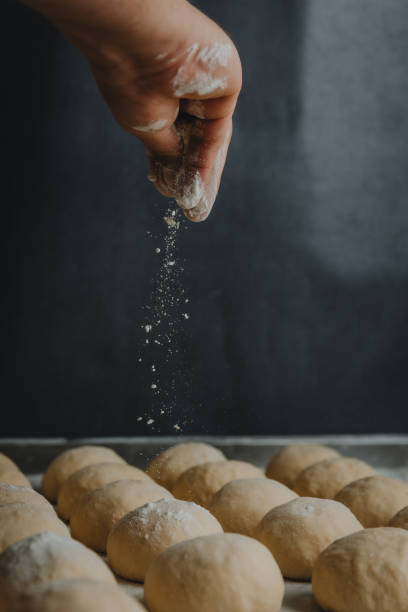 istock Person adding flour to homemade pastry dough balls 1465493521