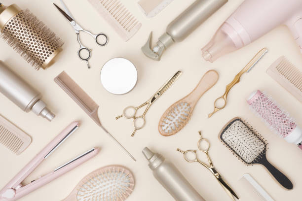 istock Hairdressing tools and various hairbrushes on cream background top view 1465493541
