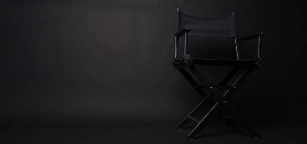 istock Black Director chair on black blackground. 1465496113