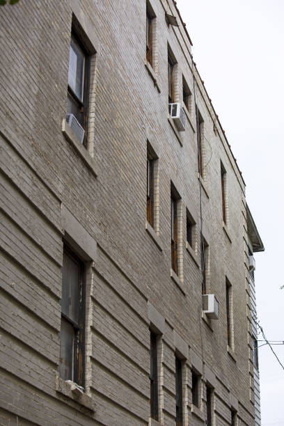 istock Vertical shot of the modern common grey building from the side. 1465496462