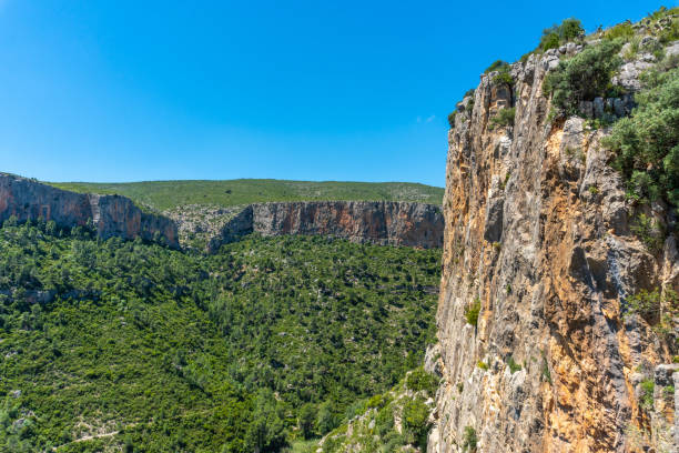 istock Landscape of rocky cliffs covered in greenery under the sunlight in Chulilla, Spain 1465497347