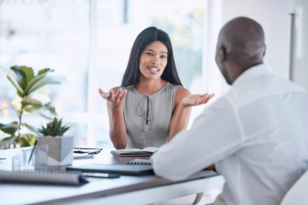 job interview, recruitment and black man and black woman talking, having conversation and discussion. management, boss and woman in business meeting with man for job, employment and hiring in office - gesturing interview business sitting imagens e fotografias de stock