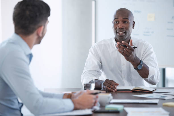 istock Teamwork, diversity or business people writing notes for marketing idea, planning networking schedule for digital data analysis. Creative, designer or black man mentor for social media SEO analytics 1465497791