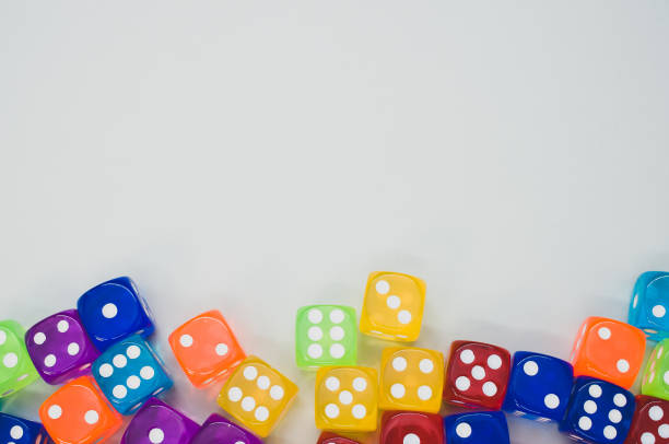 istock Top view of colorful dices isolated on light gray background 1465498151