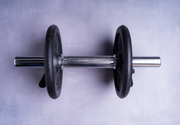 istock Top view of collapsible dumbbells on a gray background 1465499516
