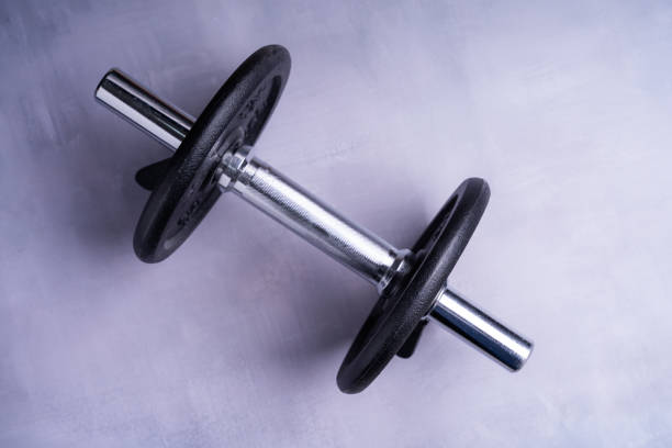 istock Top view of collapsible dumbbells on a gray background 1465499519