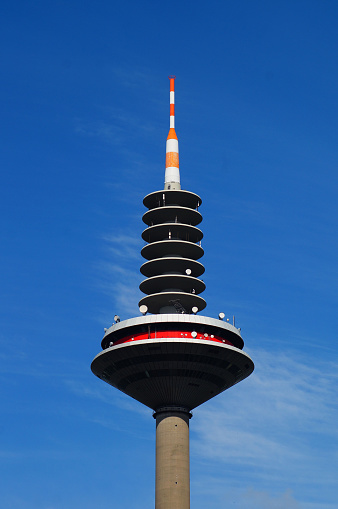 Frankfurt Television tower against a blue sky. The official name is 'Europaturm'. The citizens call it 'Ginnheimer Spargel'.