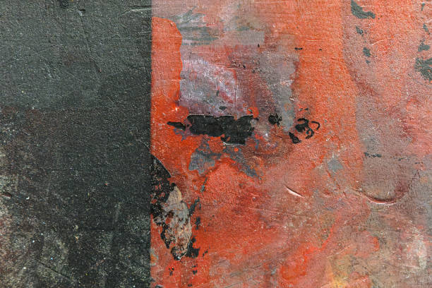 istock Rough stone wall texture covered with red and black paint 1465500042