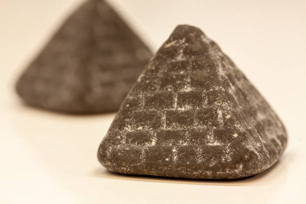 istock Closeup shot of pyramid chocolates on a white background 1465502772