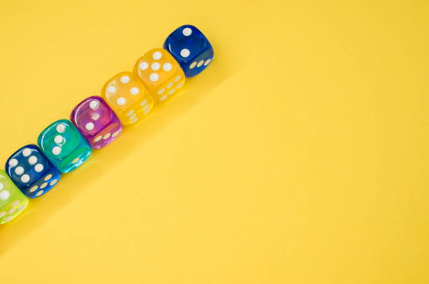 istock Dice in a row isolated on a yellow background 1465503021