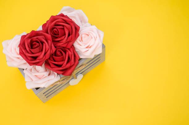 Floral autumn background with autumn colors on wooden floor, 3d paper cut style flowers. Digitally generated image. 3d render.