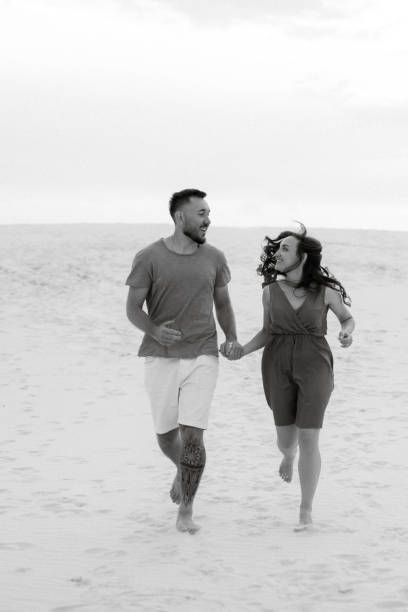 istock young couple in orange clothes with dog 1465504044