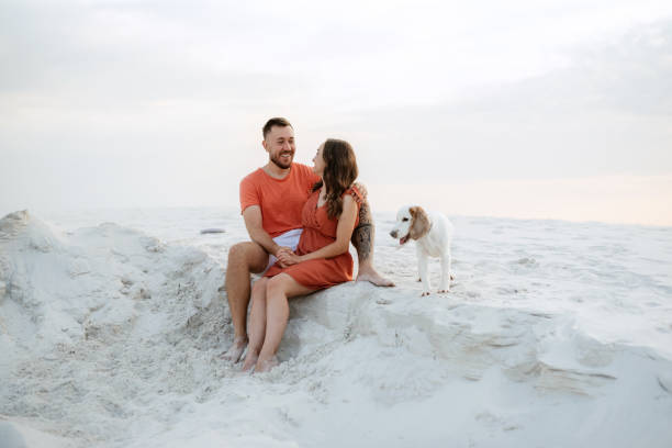 istock young couple in orange clothes with dog 1465504281