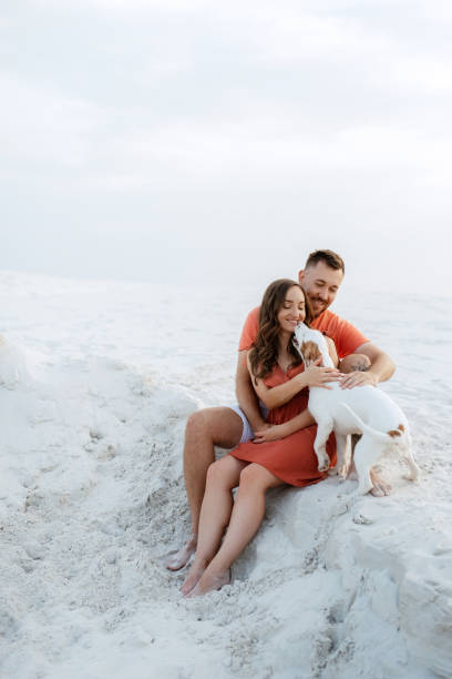 istock young couple in orange clothes with dog 1465504378