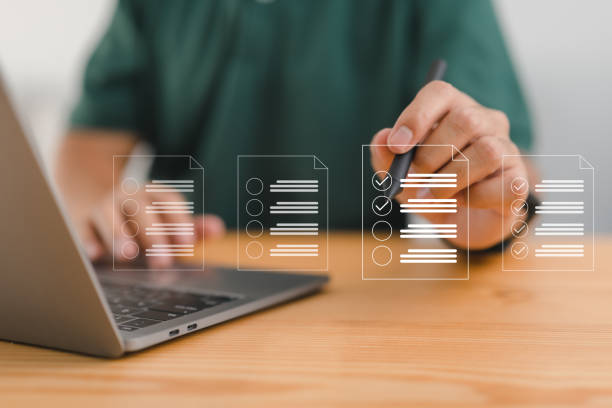 istock Checklist and clipboard task documentation management, online survey form completion Corporate business technology includes a document management system (DMS). 1465504516