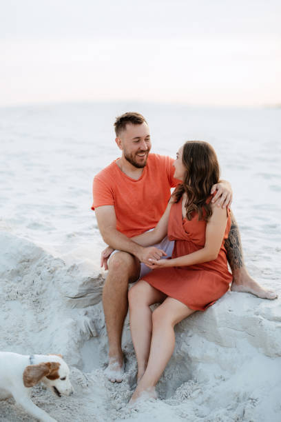 istock young couple in orange clothes with dog 1465504562