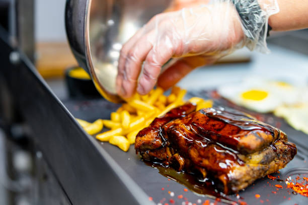 istock Professional chef cooking meat rib in the kitchen restaurant 1465504681