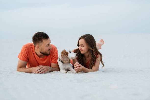 istock young couple in orange clothes with dog 1465504763
