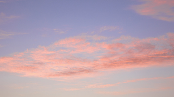 Clouds at sunset. Atmospheric pink sky. Abstract natural background, beautiful in nature.