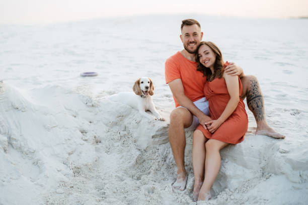 istock young couple in orange clothes with dog 1465505416