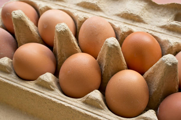 istock Closeup shot of fresh eggs in a box 1465506031
