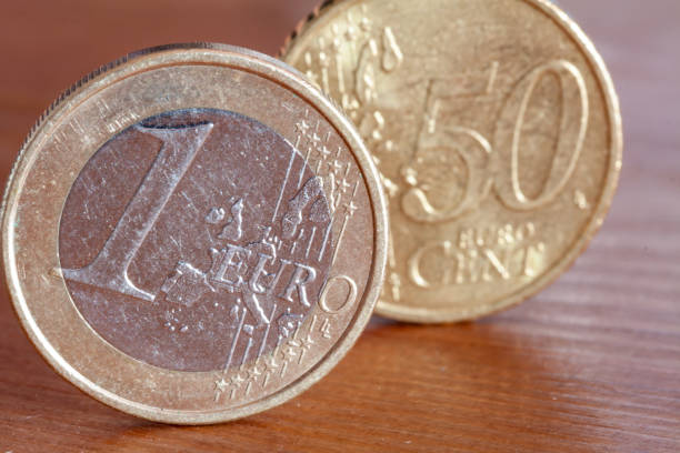 istock Eurocents on a wooden table 1465506503