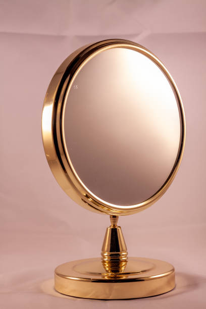 istock Golden mirror isolated on a pink background 1465506999