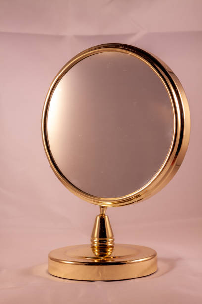 istock Vertical shot of a golden framed rond mirror 1465507000