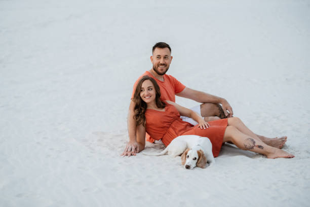 istock young couple in orange clothes with dog 1465507991