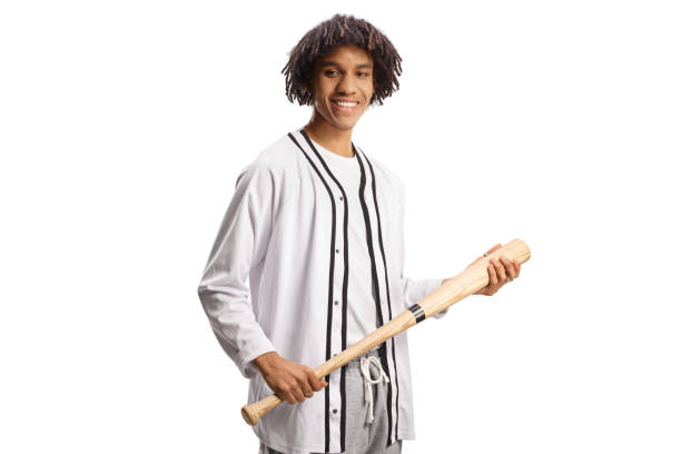 istock African american guy holding a baseball bat and smiling 1465507998