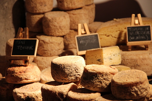 French cheese products in a warehouse with signboards