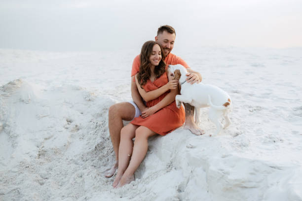 istock young couple in orange clothes with dog 1465508526