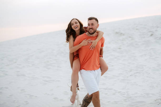 istock young couple in orange clothes with dog 1465509282