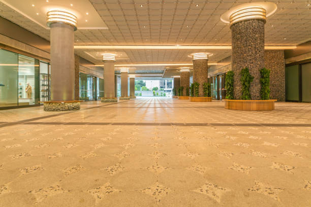 istock Empty ground floor of a modern building with lights 1465510275
