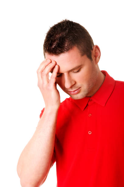 A stressed Polish man with a headache isolated on white background