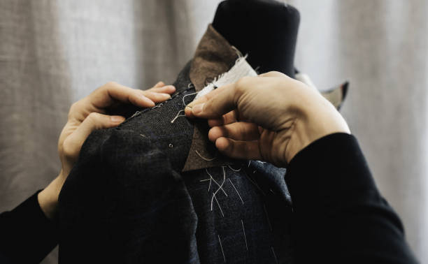 istock male tailor works in a costume workshop 1465512003